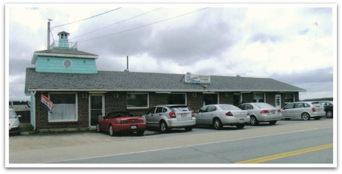 Exterior of Island View Restaurant with cars parked outside